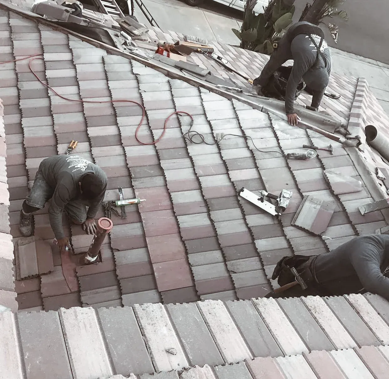 Chavez Roofing crew installing concrete roof tile