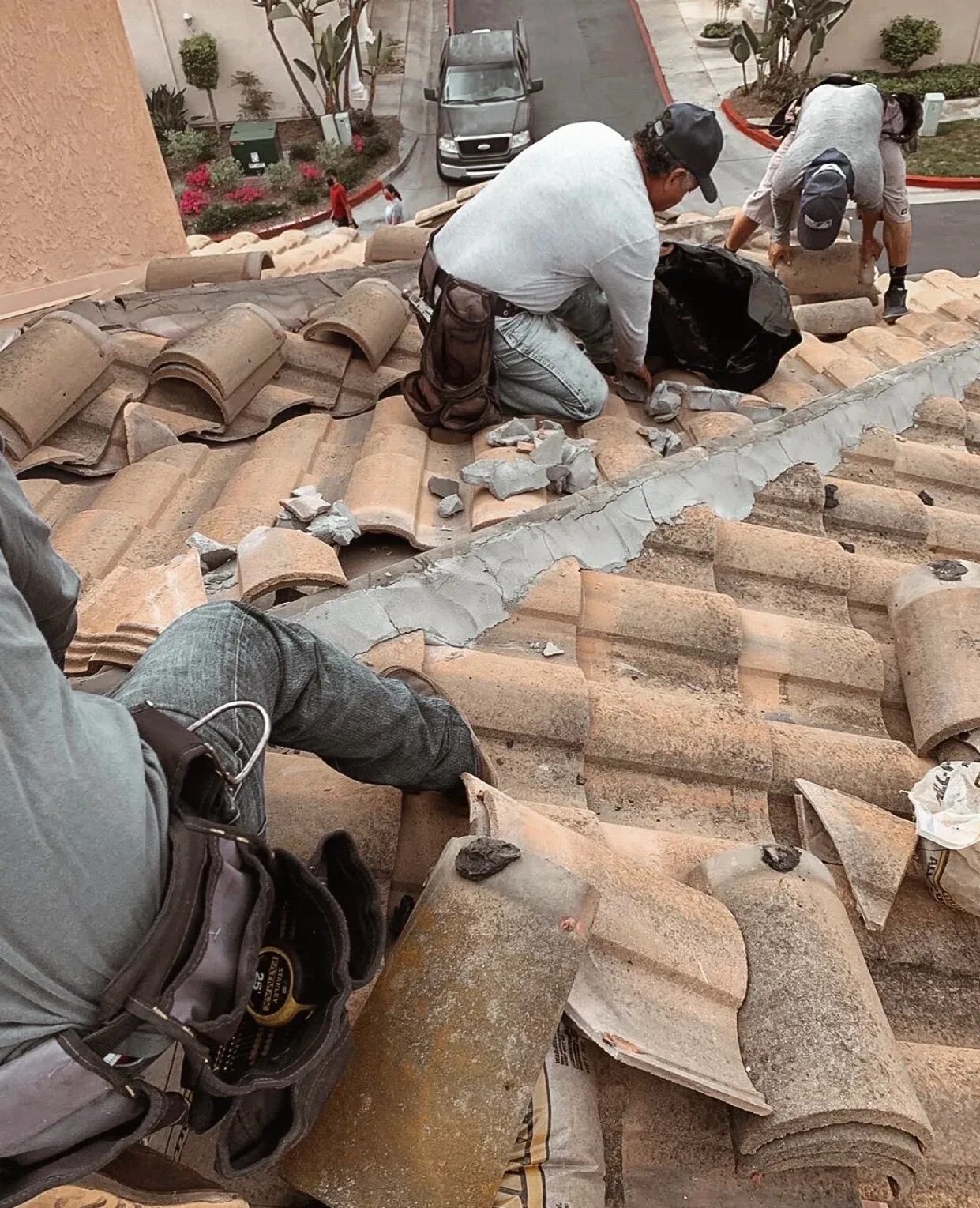 Chavez Roofing crew setting clay roof tile together