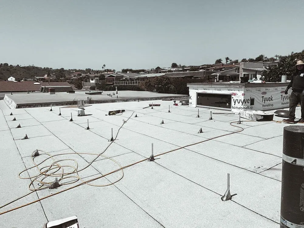 A flat cool roof installed on a building