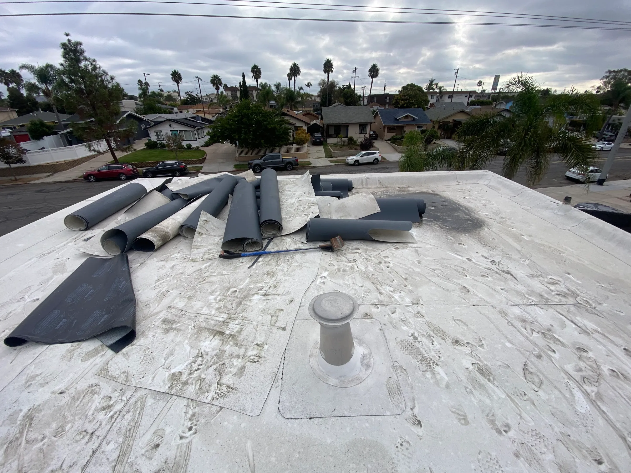 Rolls of roofing membrane on a flat roof job